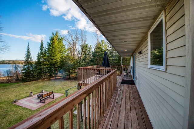 32061 Primrose Ln, Walker, MN 56461 - deck featuring a yard, a water view, and outdoor dining area