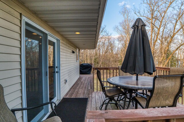 32061 Primrose Ln, Walker, MN 56461 - deck with outdoor dining area and area for grilling