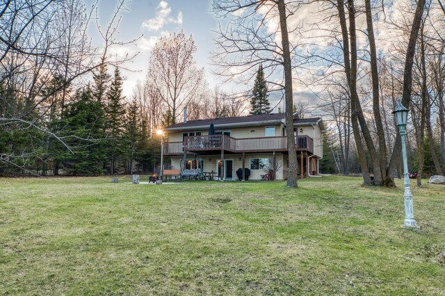 32061 Primrose Ln, Walker, MN 56461 - back of property with a deck and a lawn