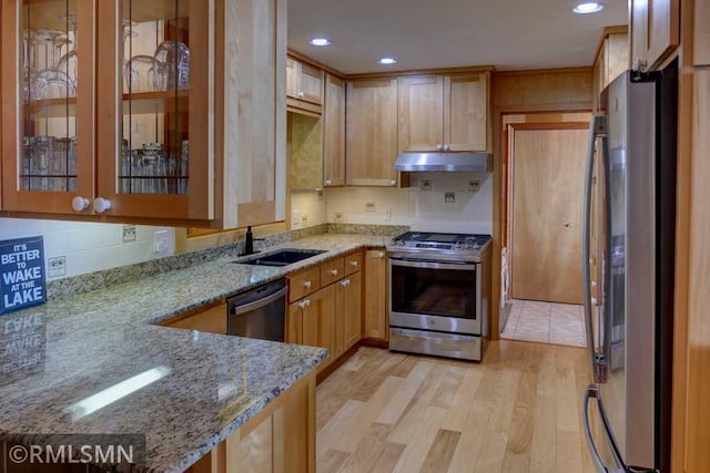 802 Flos Ct, Lincoln Twp, WI 54001 - kitchen with appliances with stainless steel finishes, a sink, under cabinet range hood, light stone counters, and recessed lighting