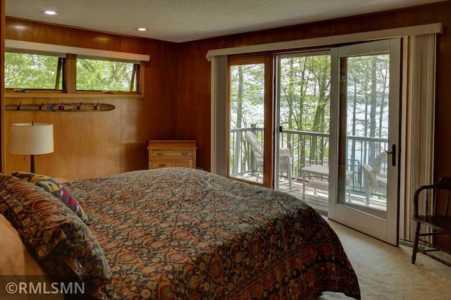 802 Flos Ct, Lincoln Twp, WI 54001 - bedroom featuring access to outside, light carpet, and wood walls