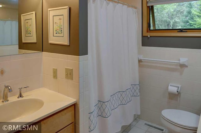 802 Flos Ct, Lincoln Twp, WI 54001 - bathroom featuring tile walls, toilet, tile patterned floors, vanity, and a shower with curtain