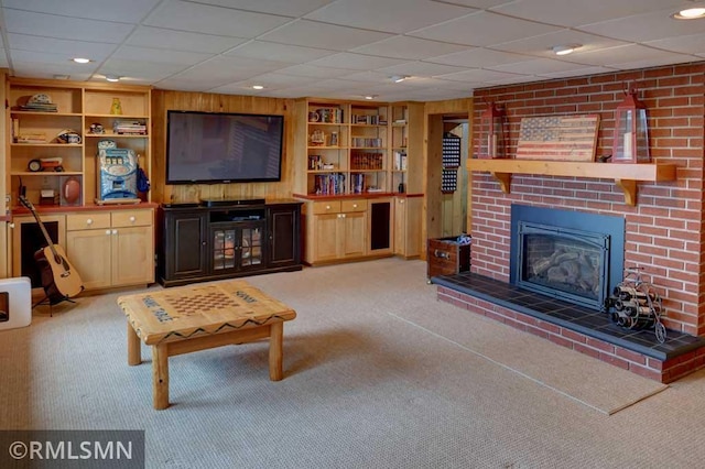 802 Flos Ct, Lincoln Twp, WI 54001 - living room with carpet floors, built in shelves, a fireplace, and a drop ceiling