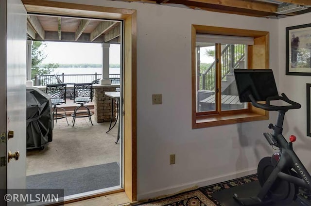802 Flos Ct, Lincoln Twp, WI 54001 - workout area with a water view and baseboards