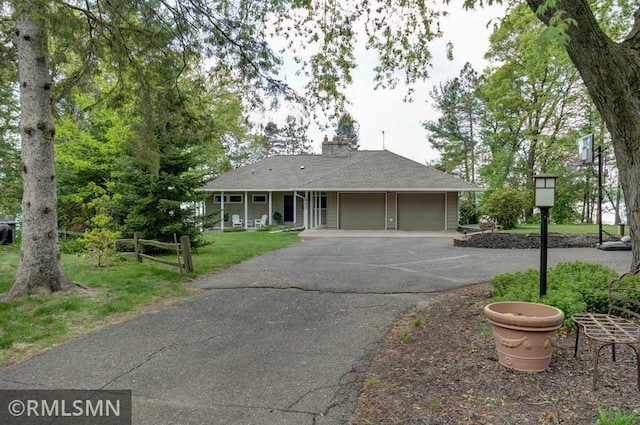 802 Flos Ct, Lincoln Twp, WI 54001 - ranch-style house with a garage, asphalt driveway, and a chimney