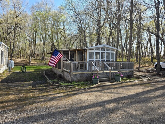 2481 Lake Miltona Dr NE Unit 1, Miltona Twp, MN 56354 - view of front of property with a sunroom and a wooden deck