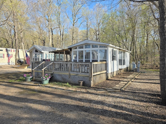 2481 Lake Miltona Dr NE Unit 1, Miltona Twp, MN 56354 - exterior space featuring a sunroom and a deck