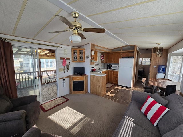 2481 Lake Miltona Dr NE Unit 1, Miltona Twp, MN 56354 - carpeted living area with vaulted ceiling and a ceiling fan