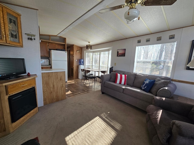 2481 Lake Miltona Dr NE Unit 1, Miltona Twp, MN 56354 - living room featuring dark carpet, ceiling fan, and vaulted ceiling