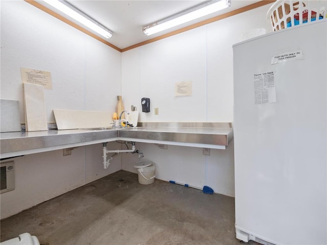 2481 Lake Miltona Dr NE Unit 1, Miltona Twp, MN 56354 - interior space featuring built in study area, unfinished concrete flooring, and a sink