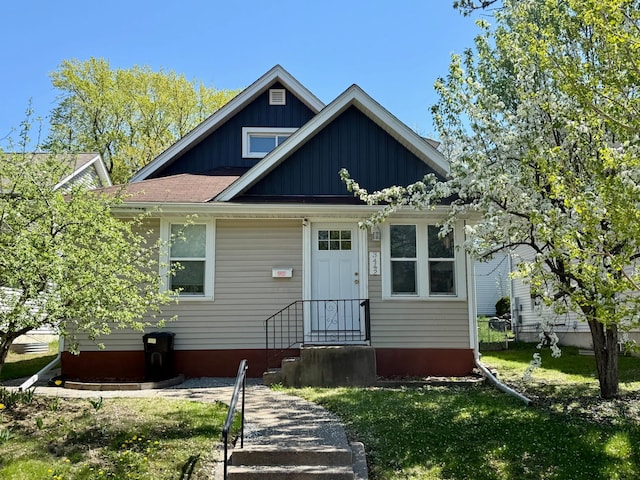 bungalow with a front lawn