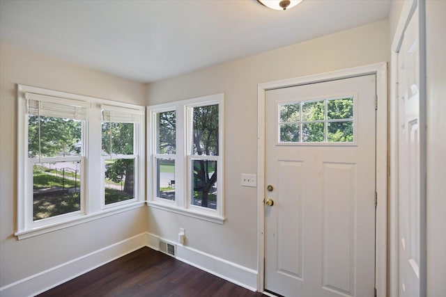 entryway with baseboards and dark wood-style floors