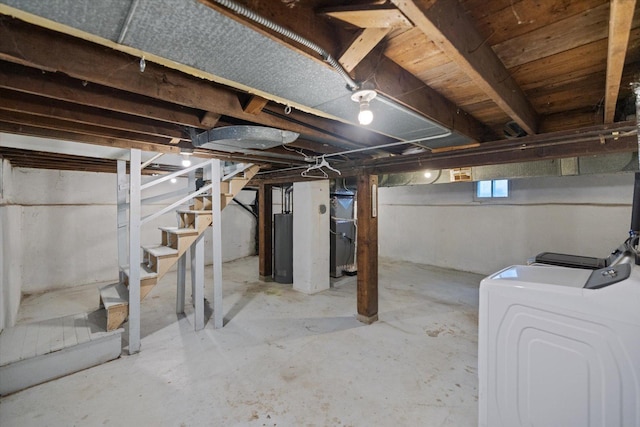 basement featuring washer and dryer and stairway