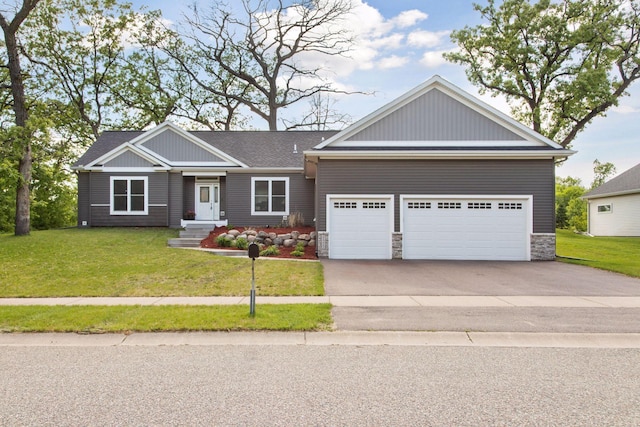 21212 Old Lake George Blvd NW, Oak Grove, MN 55303 - view of front of house with an attached garage, driveway, a front yard, and stone siding