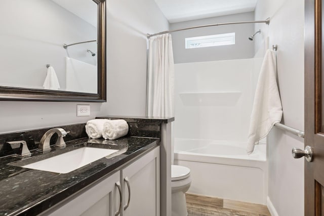 21212 Old Lake George Blvd NW, Oak Grove, MN 55303 - full bathroom with toilet, shower / bathtub combination with curtain, wood finished floors, and vanity