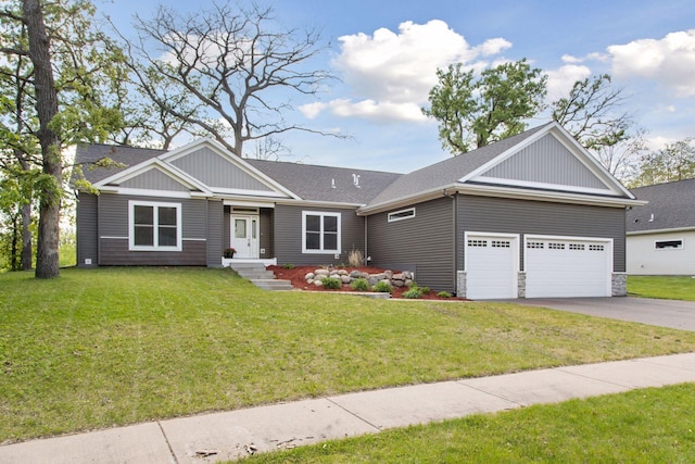 21212 Old Lake George Blvd NW, Oak Grove, MN 55303 - view of front of home featuring board and batten siding, a front yard, concrete driveway, and an attached garage