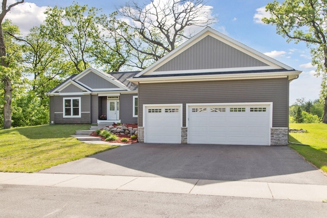 21212 Old Lake George Blvd NW, Oak Grove, MN 55303 - craftsman inspired home featuring stone siding, a front lawn, a garage, and asphalt driveway
