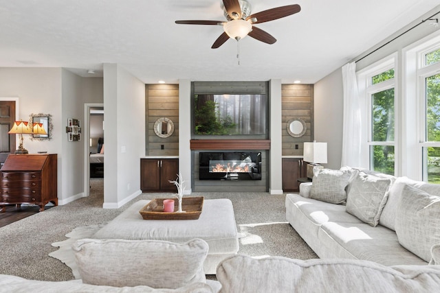 21212 Old Lake George Blvd NW, Oak Grove, MN 55303 - carpeted living room with baseboards, a ceiling fan, a glass covered fireplace, and recessed lighting