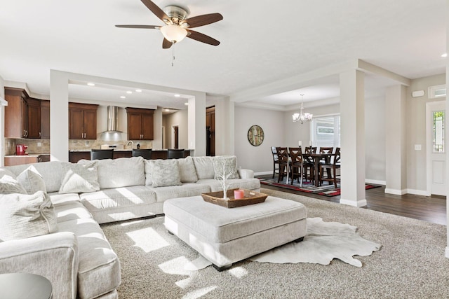 21212 Old Lake George Blvd NW, Oak Grove, MN 55303 - living room with recessed lighting, baseboards, ceiling fan, a chandelier, and dark colored carpet