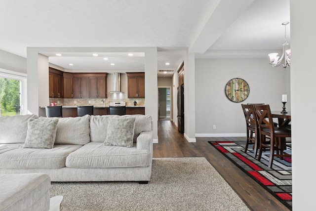 21212 Old Lake George Blvd NW, Oak Grove, MN 55303 - living area with dark wood-style flooring, baseboards, a chandelier, and recessed lighting