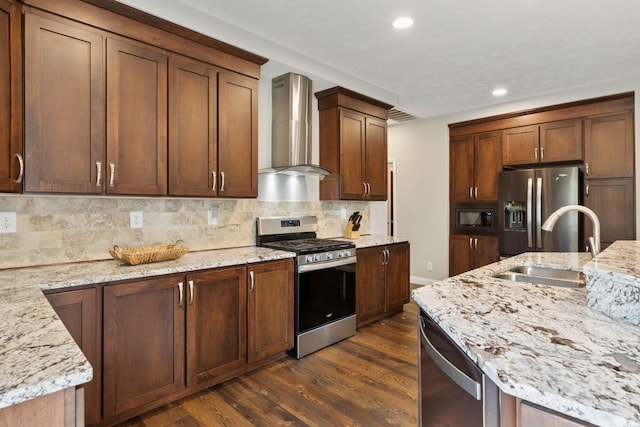 21212 Old Lake George Blvd NW, Oak Grove, MN 55303 - kitchen with stainless steel appliances, wall chimney range hood, a sink, dark wood-type flooring, and light stone counters