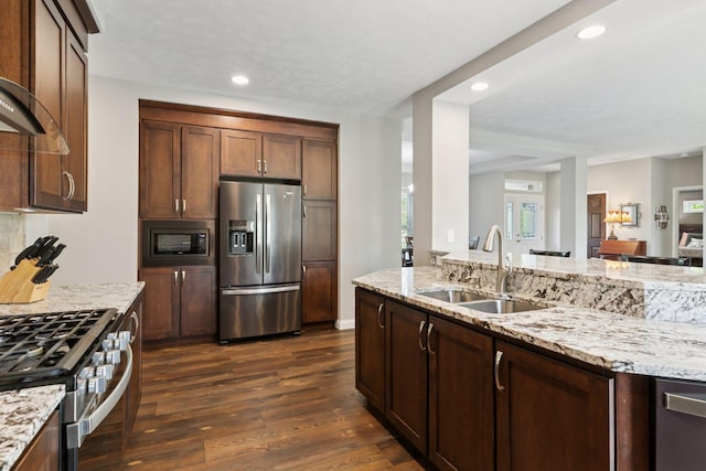 21212 Old Lake George Blvd NW, Oak Grove, MN 55303 - kitchen with stainless steel appliances, a sink, dark wood-style flooring, light stone counters, and recessed lighting