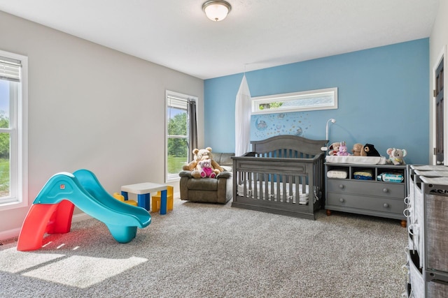 21212 Old Lake George Blvd NW, Oak Grove, MN 55303 - carpeted bedroom featuring a nursery area