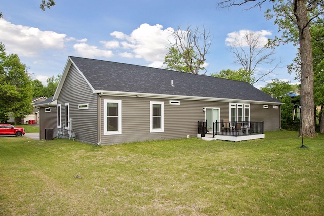 21212 Old Lake George Blvd NW, Oak Grove, MN 55303 - rear view of property featuring a deck, a lawn, cooling unit, and roof with shingles