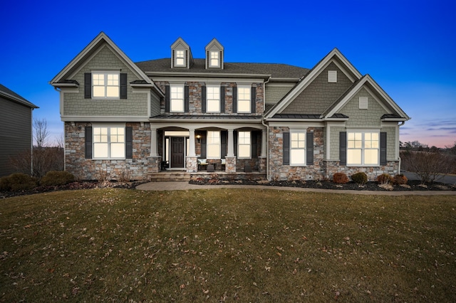 16302 Sohm Ct, Eden Prairie, MN 55347 - craftsman-style house with a front lawn, stone siding, roof with shingles, and covered porch