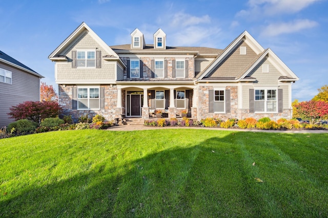 16302 Sohm Ct, Eden Prairie, MN 55347 - view of front facade with covered porch, a front lawn, and stone siding