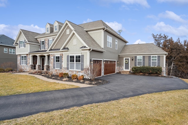 16302 Sohm Ct, Eden Prairie, MN 55347 - view of front of property with stone siding, a porch, a garage, and aphalt driveway