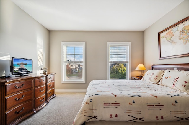 16302 Sohm Ct, Eden Prairie, MN 55347 - bedroom with multiple windows, light carpet, and baseboards