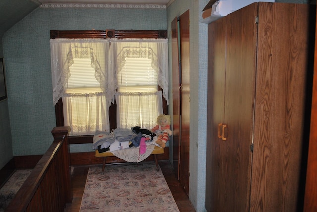bedroom with dark wood finished floors