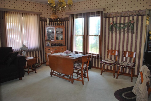 office space featuring a chandelier, carpet flooring, and wallpapered walls
