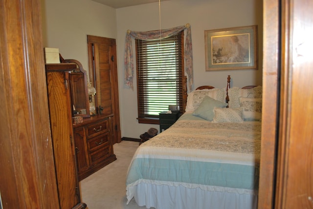 bedroom with light colored carpet