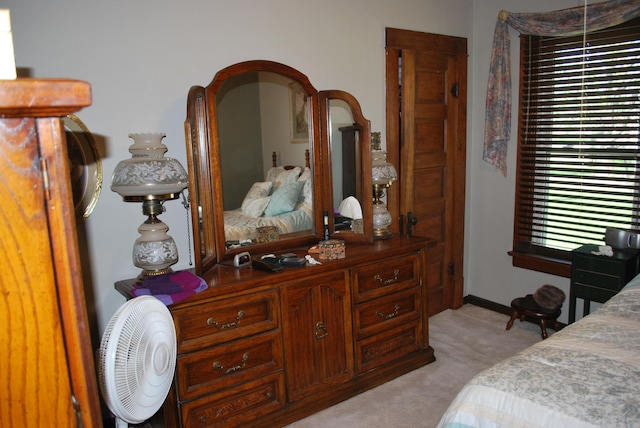 bedroom with light colored carpet