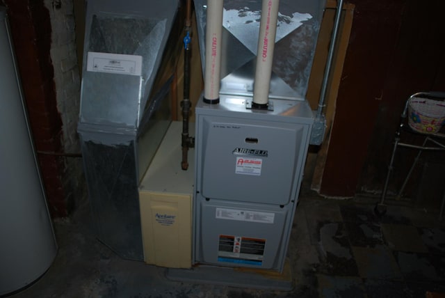utilities with water heater and heating unit