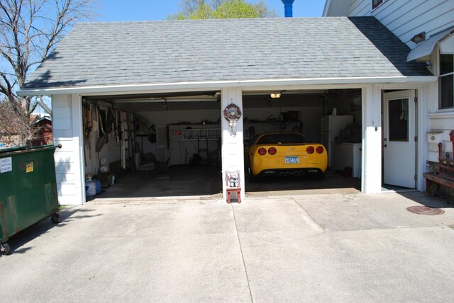 garage with freestanding refrigerator
