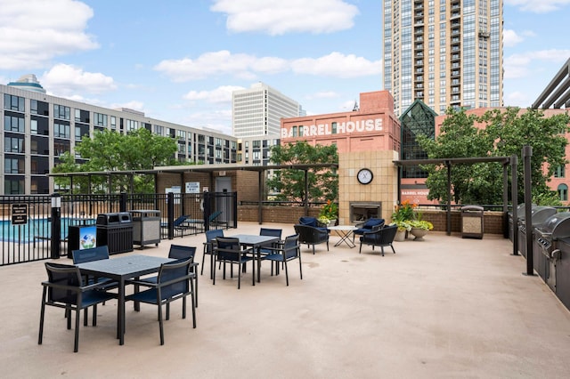 401 1st St Unit 1321, Minneapolis, MN 55401 - view of patio with a fireplace and a grill