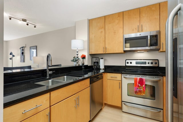 401 1st St Unit 1321, Minneapolis, MN 55401 - kitchen featuring stainless steel appliances, light wood-style flooring, and dark stone counters