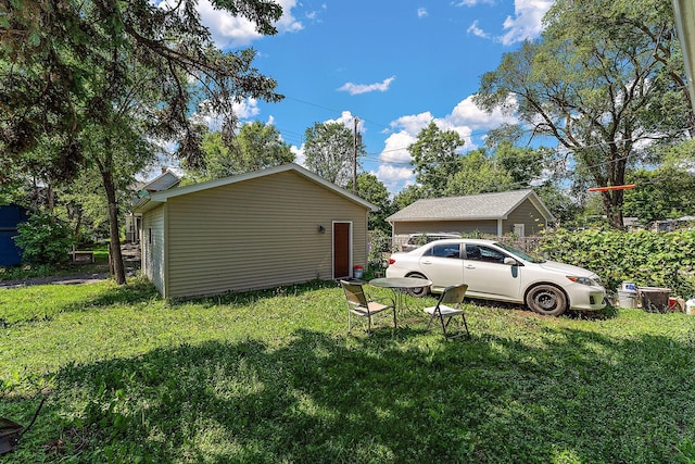 864 Fuller Ave, Saint Paul, MN 55104 - view of property exterior with a lawn and an outbuilding
