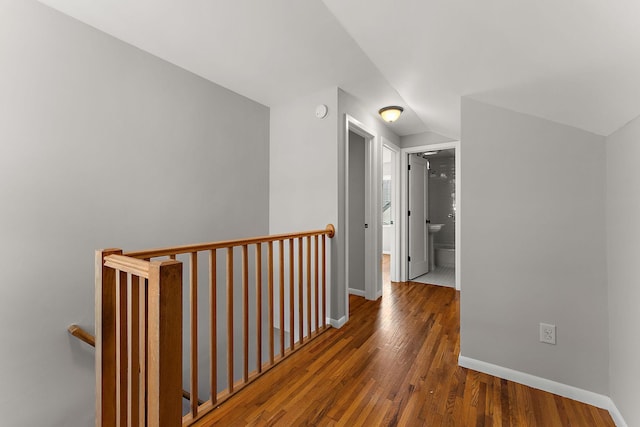 864 Fuller Ave, Saint Paul, MN 55104 - hallway featuring an upstairs landing, wood finished floors, and lofted ceiling