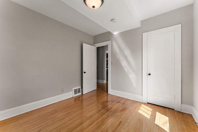 864 Fuller Ave, Saint Paul, MN 55104 - unfurnished bedroom featuring light wood-type flooring and baseboards