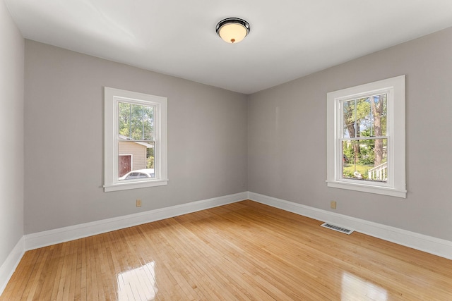 864 Fuller Ave, Saint Paul, MN 55104 - empty room with baseboards and light wood-style floors