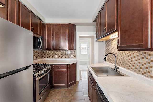 864 Fuller Ave, Saint Paul, MN 55104 - kitchen with appliances with stainless steel finishes, backsplash, light countertops, and dark brown cabinets
