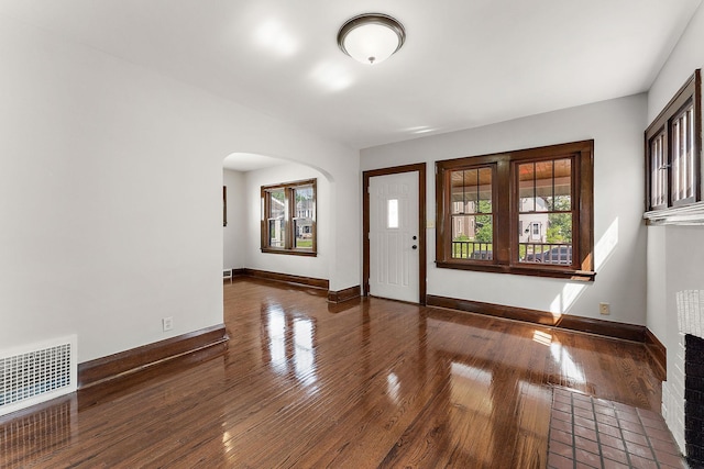 864 Fuller Ave, Saint Paul, MN 55104 - entrance foyer featuring arched walkways, wood-type flooring, and plenty of natural light