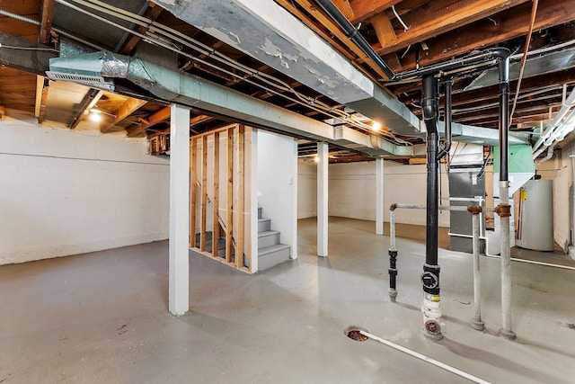 864 Fuller Ave, Saint Paul, MN 55104 - unfinished below grade area featuring water heater and stairway