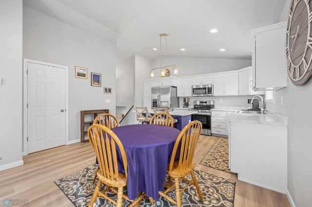 dining area featuring light wood-type flooring, baseboards, high vaulted ceiling, and recessed lighting