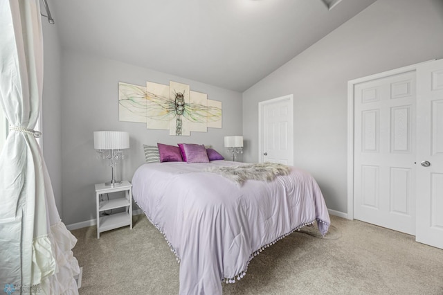 bedroom with carpet flooring, vaulted ceiling, and baseboards