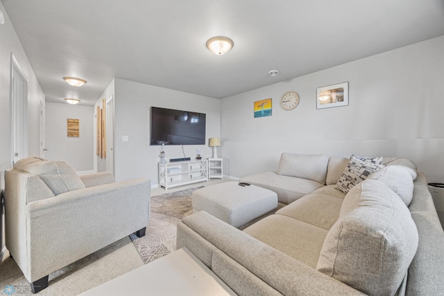 living area with carpet and baseboards